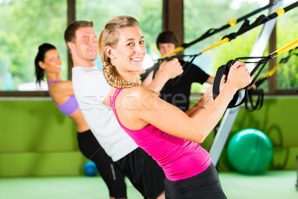 Stock photo: Fitness - Leute beim Suspension training