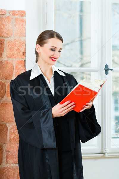 Stock photo: Lawyer in office reading law book