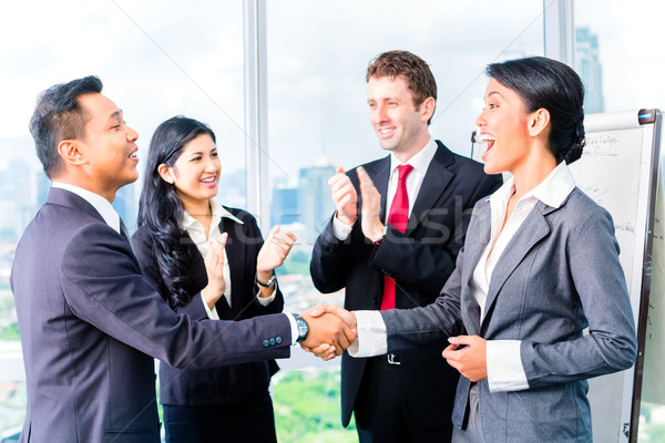 Asian Businesspeople shaking hands Stock photo © Kzenon