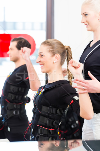 Man and woman having ems training Stock photo © Kzenon