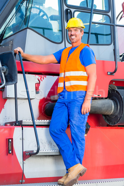 Crane operator standing proud on company yard Stock photo © Kzenon