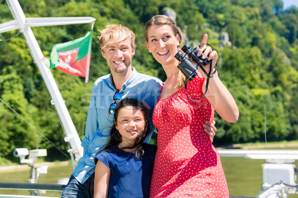 Family on river cruise with binoculars in summer Stock photo © Kzenon
