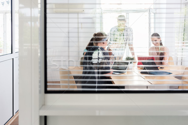 Close-up of the interior window of a modern work hub with shared offices Stock photo © Kzenon