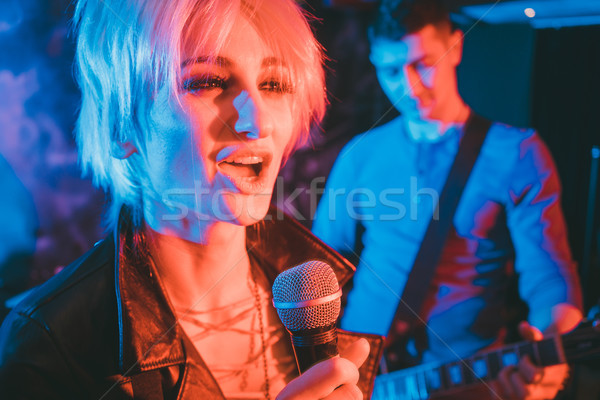 Singer and guitar player on stage during band gig Stock photo © Kzenon