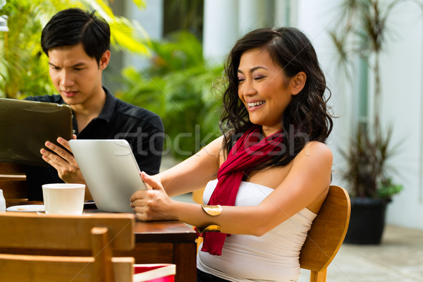 Asian people in cafe with computer Stock photo © Kzenon