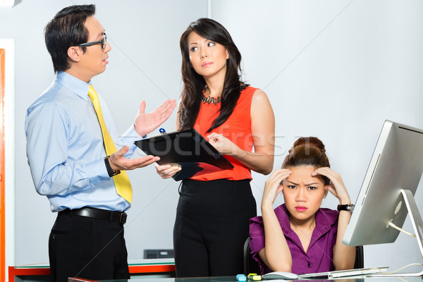 Asian colleagues mobbing or bullying employee  Stock photo © Kzenon