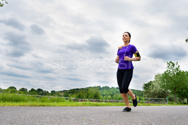 Sports outdoor - young woman running in park Stock photo © Kzenon