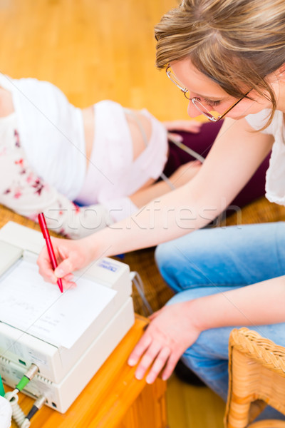 Midwife seeing mother for pregnancy examination Stock photo © Kzenon