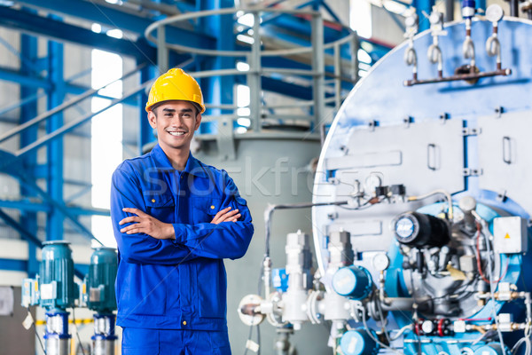 Proud Asian worker in production factory Stock photo © Kzenon