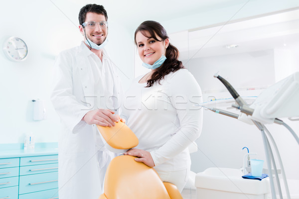 Dentist and nurse in their clinic as team Stock photo © Kzenon