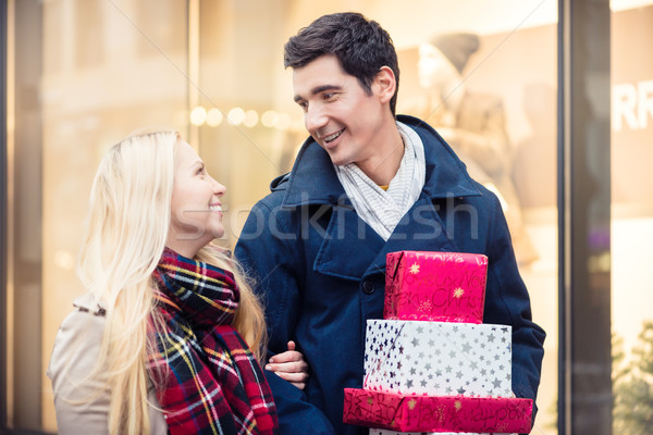 Stock photo: Woman and man with Christmas presents in city