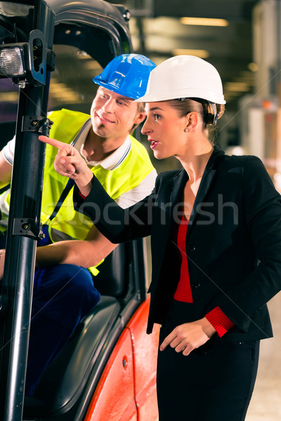 Forklift driver and supervisor at warehouse Stock photo © Kzenon