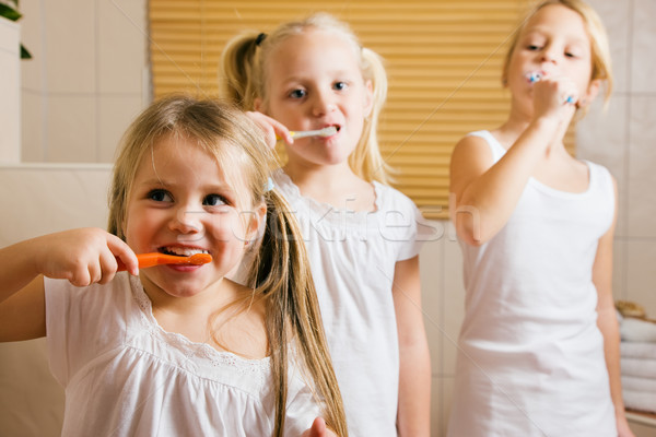 Children brushing teeth Stock photo © Kzenon