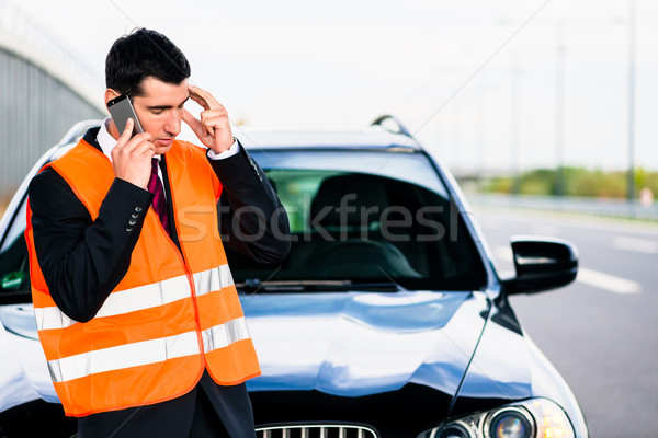 Man with car breakdown calling towing company Stock photo © Kzenon