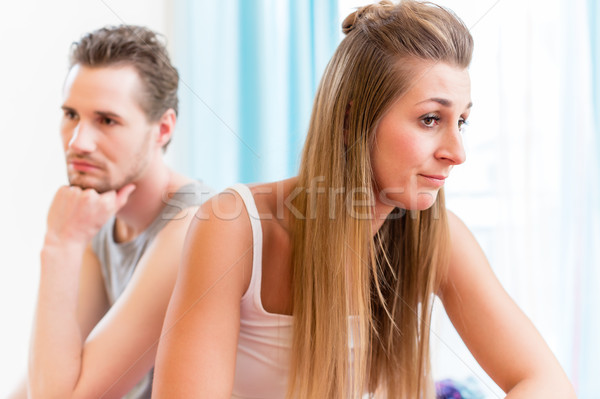 Man and woman in hush after having domestic quarrel looking sad Stock photo © Kzenon
