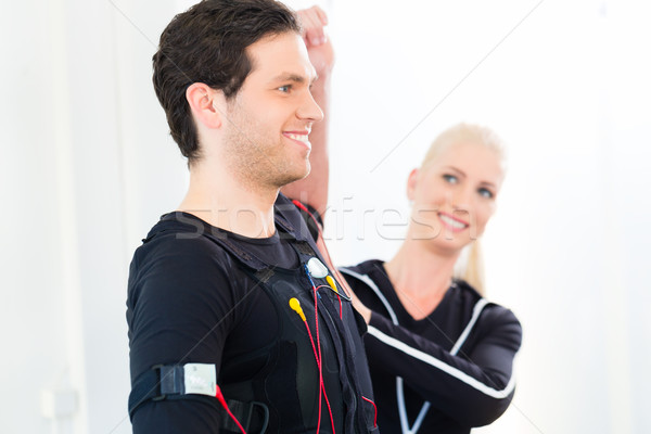 Man and woman having ems training Stock photo © Kzenon