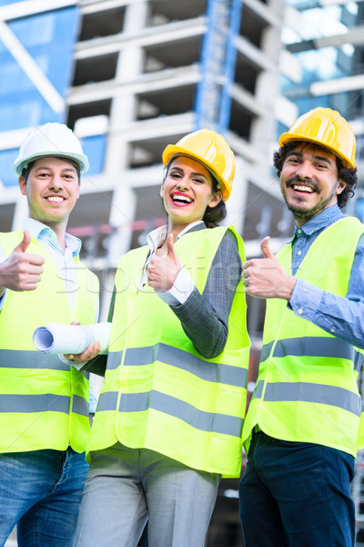 Stock photo: Team of civil engineers and architects at construction 