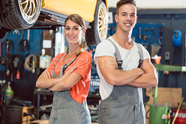 Portrait of two skilled auto mechanics looking at camera with confidence Stock photo © Kzenon