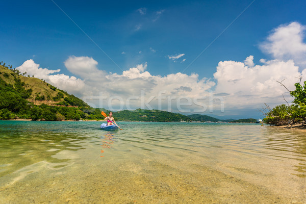 Fiatal nő vakáció idilli úticél boldog kenu Stock fotó © Kzenon