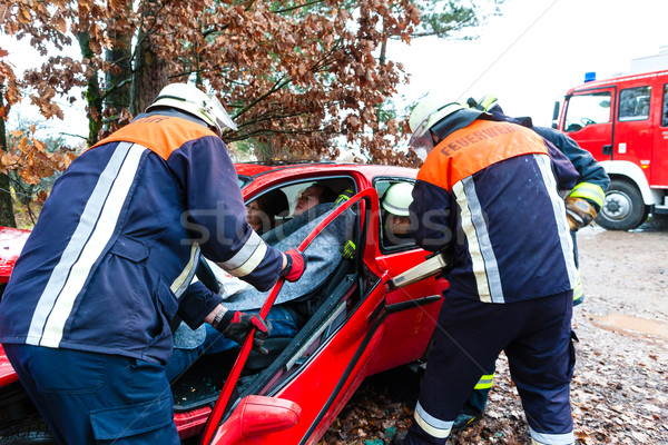 Stock photo: Accident - Fire brigade rescues Victim of a car