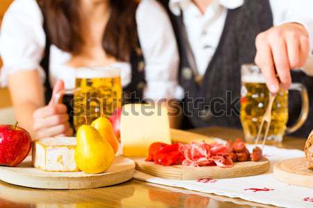 People in bavarian Tracht eating in restaurant or pub Stock photo © Kzenon