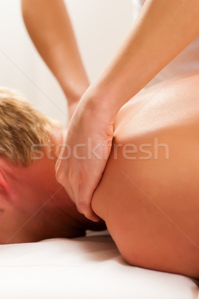 Beteg fizioterápia masszázs nő férfi testmozgás Stock fotó © Kzenon