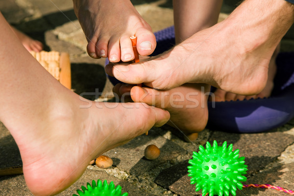 Healthy feet - feet gymnastics Stock photo © Kzenon