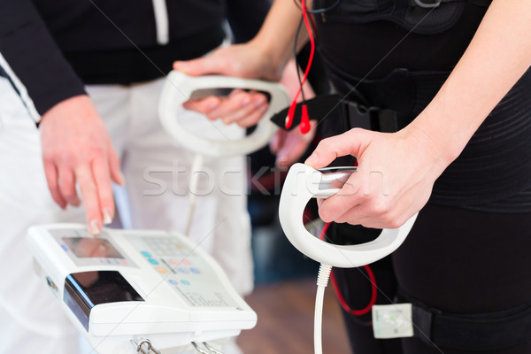 Woman having body fat measuring Stock photo © Kzenon