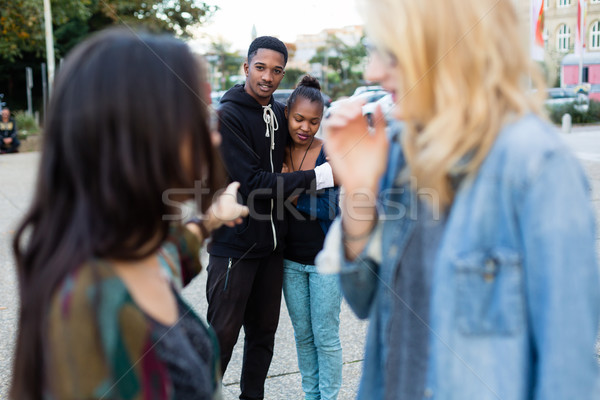 Racism - black couple being bullied Stock photo © Kzenon