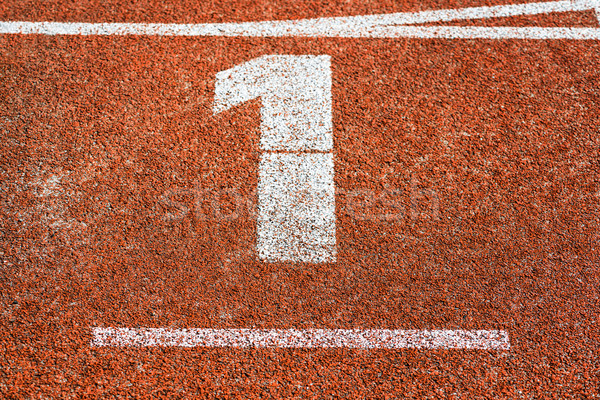 Start number one at cinder track of track and field running trac Stock photo © Kzenon