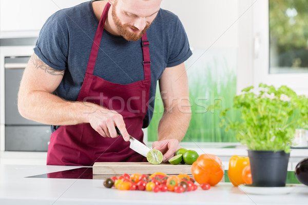 Man preparing food for cooking in kitchen Stock photo © Kzenon