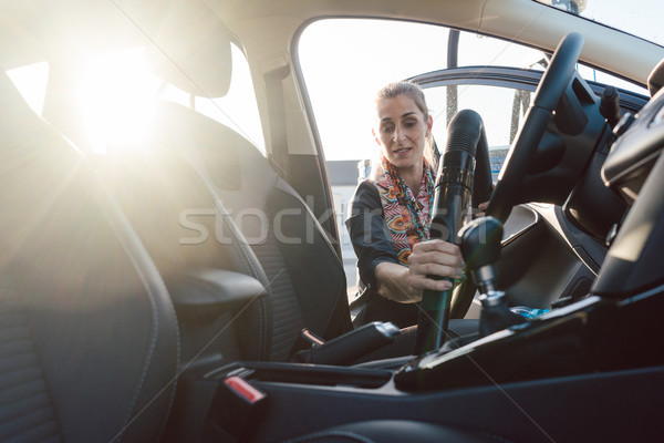 Woman cleaning inside of car Stock photo © Kzenon