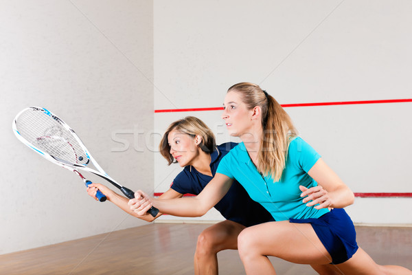 Squash sport - women playing on gym court Stock photo © Kzenon
