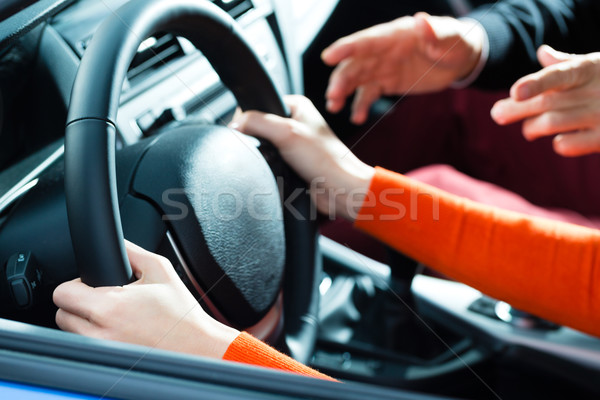 Young woman at driving lesson Stock photo © Kzenon