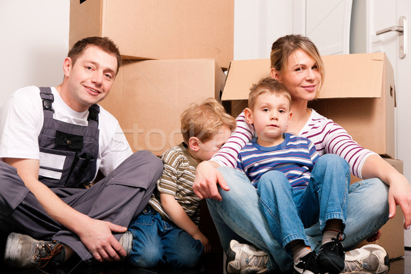 Family moving in their new home  Stock photo © Kzenon