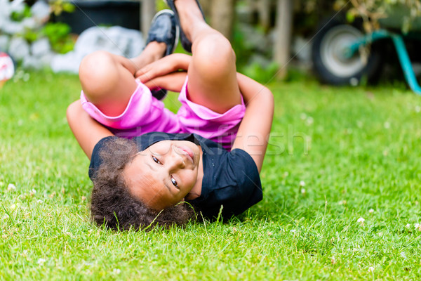 African girl playing on meadow  Stock photo © Kzenon