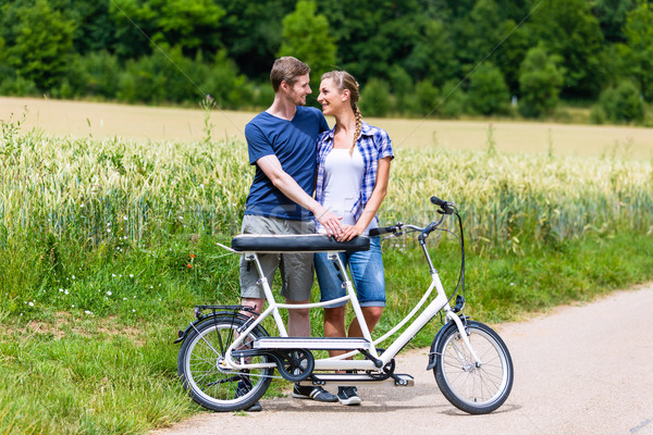 Couple riding tandem bike together in the country Stock photo © Kzenon