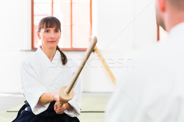 Man and woman having Aikido sword fight Stock photo © Kzenon