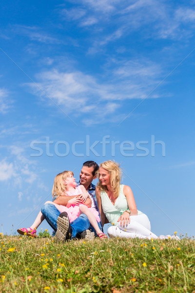 Mother, father, child, sitting in open air Stock photo © Kzenon
