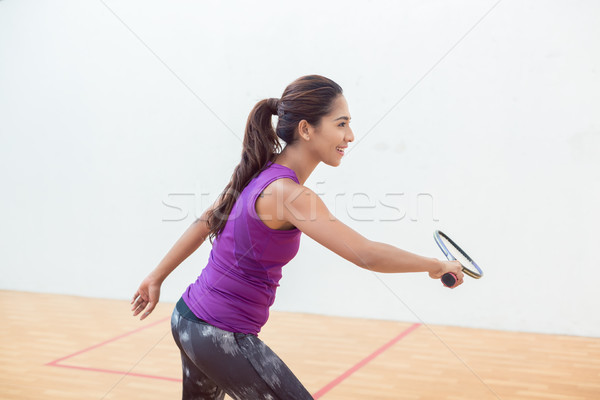 Young squash player holding the racket during game on a professional court Stock photo © Kzenon