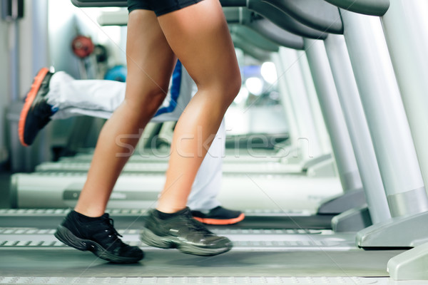 People on treadmill in gym running Stock photo © Kzenon