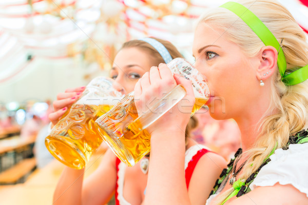 Friends drinking Bavarian beer at Oktoberfest Stock photo © Kzenon