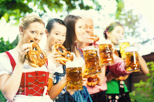 Beer garden - friends drinking in Bavaria Pub Stock photo © Kzenon