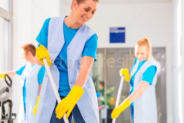 Commercial cleaning brigade working Stock photo © Kzenon