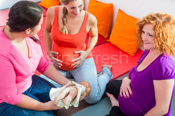 Midwife explaining birth process to pregnant women during antena Stock photo © Kzenon