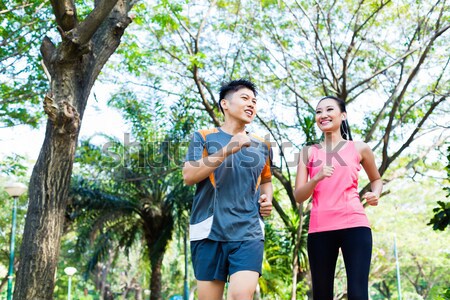 Man congratulating his girlfriend to finishing fitness exercise Stock photo © Kzenon