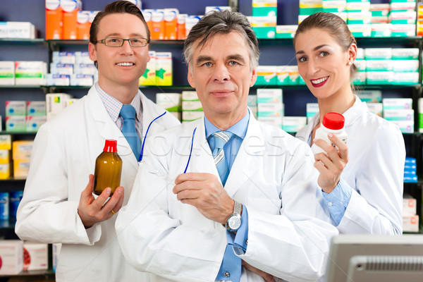Team of pharmacists in pharmacy Stock photo © Kzenon