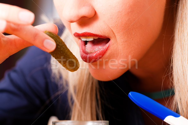 pregnant woman eating pickles  Stock photo © Kzenon