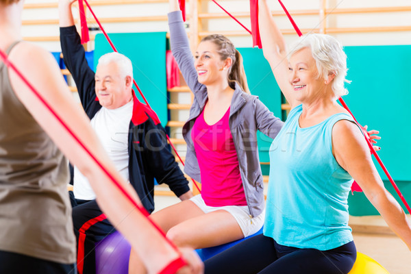 Senior people at fitness course in gym Stock photo © Kzenon