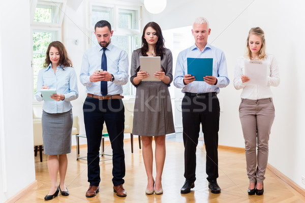 Concept - business people in office standing in row Stock photo © Kzenon